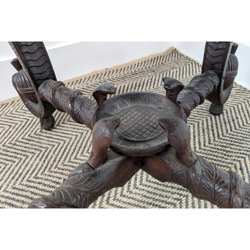 140 - LOW TABLE, early 20th century Indian teak with circular top on elephant carved legs, 62cm H x 74cm W... 