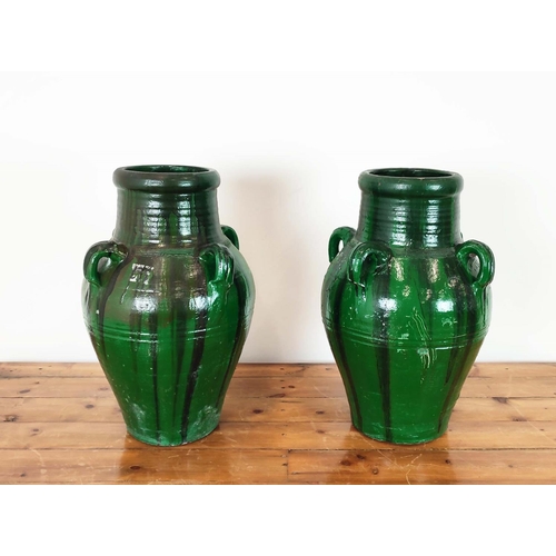 420 - GARDEN URNS, a pair, green glazed terracotta, 58cm H x 35cm W. (2)