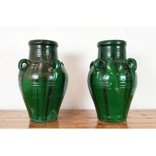 420 - GARDEN URNS, a pair, green glazed terracotta, 58cm H x 35cm W. (2)