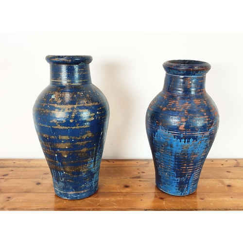 421 - GARDEN URNS, a pair, blue glazed terracotta, 61cm H x 28cm D. (2)