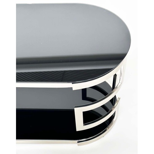 292 - LOW TABLE, oval black glass and chrome with two tiers, 117cm W x 56cm H x 56cm D.