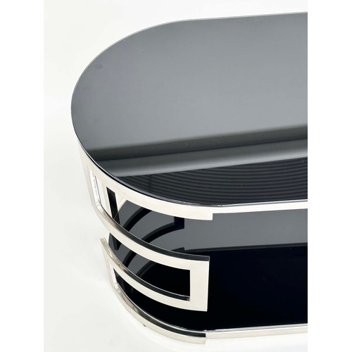 292 - LOW TABLE, oval black glass and chrome with two tiers, 117cm W x 56cm H x 56cm D.