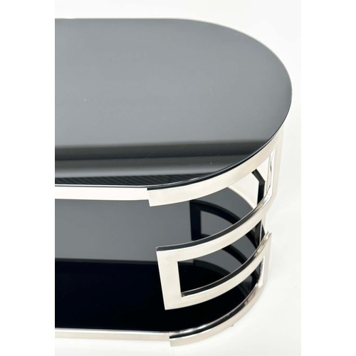 292 - LOW TABLE, oval black glass and chrome with two tiers, 117cm W x 56cm H x 56cm D.