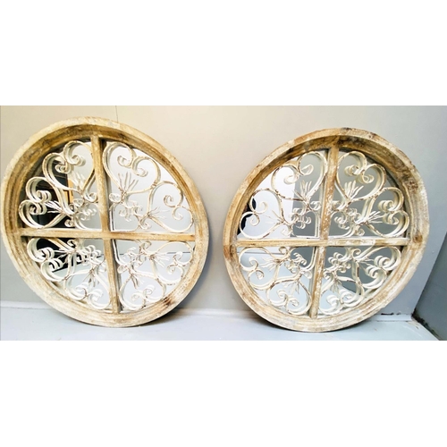 354 - ARCHITECTURAL WALL MIRRORS, a pair, circular, distressed painted frames, 72cm diam. (2)