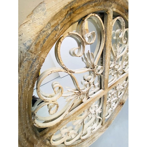 354 - ARCHITECTURAL WALL MIRRORS, a pair, circular, distressed painted frames, 72cm diam. (2)