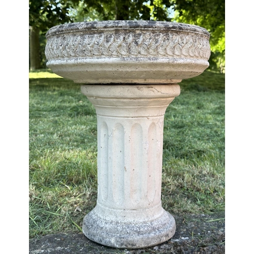 210 - GARDEN STAND, weathered reconstituted stone circular with carved edge on fluted column support, 49cm... 