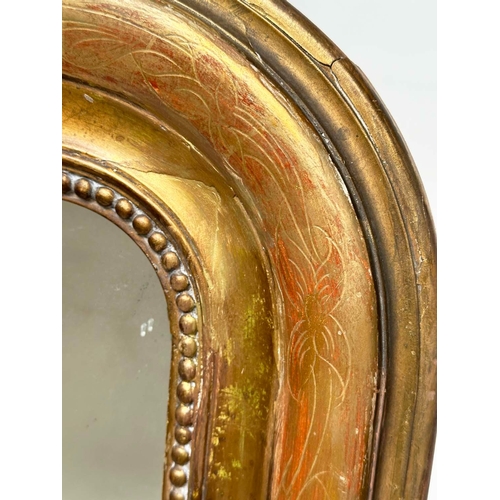 202 - WALL MIRROR, 19th century French giltwood and gesso, arched rectangular with incised and beaded fram... 