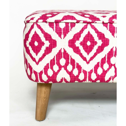 189 - WINDOW SEAT, rectangular raspberry batik print cotton, buttoned and sewn, on tapering oak supports, ... 