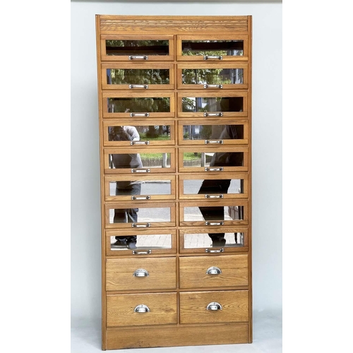 114 - HABERDASHERY CABINET, mid 20th century oak with sixteen glazed drawers above four further drawers, 1... 