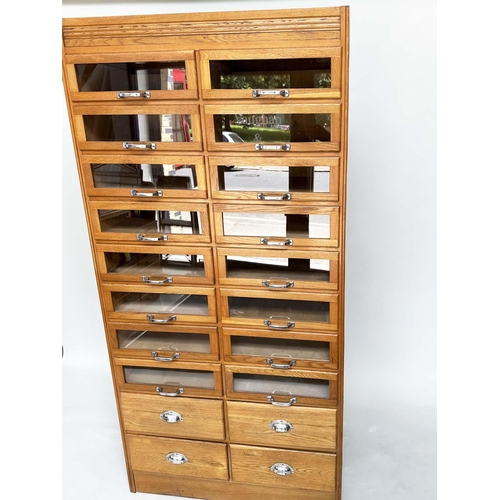 114 - HABERDASHERY CABINET, mid 20th century oak with sixteen glazed drawers above four further drawers, 1... 