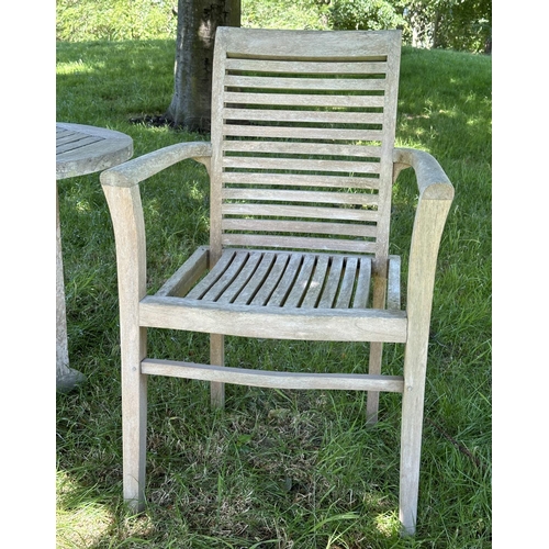 119 - GARDEN ARMCHAIRS, a pair, well weathered teak each stacking with shaped arms together with a circula... 