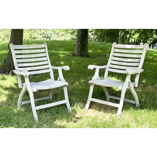 126 - GARDEN ARMCHAIRS BY ALEXANDER ROSE, a pair, weathered teak slatted and folding. (2)