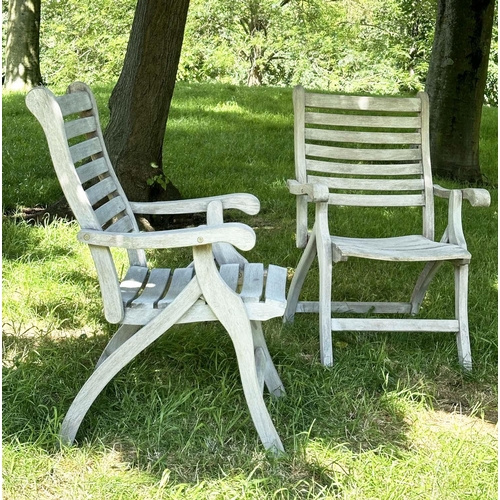 126 - GARDEN ARMCHAIRS BY ALEXANDER ROSE, a pair, weathered teak slatted and folding. (2)