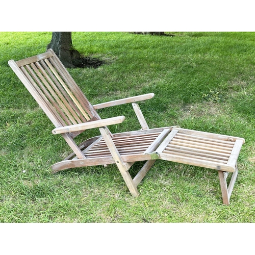 128 - STEAMER GARDEN ARMCHAIR, weathered teak and brass hinged folding slatted construction, 144cm H x 60c... 