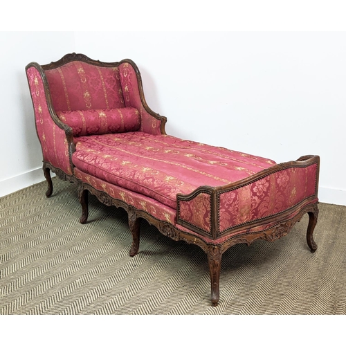 174 - DAY BED, Louis XV walnut, circa 1760, with a carved showframe and red damask upholstery, 220cm L x 8... 