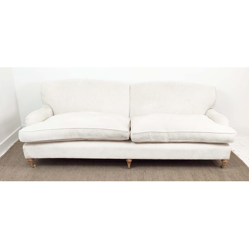 219 - SOFA, Howard style in white upholstery with turned feet and brass castors, 79cm H x 228cm W x 100cm ... 