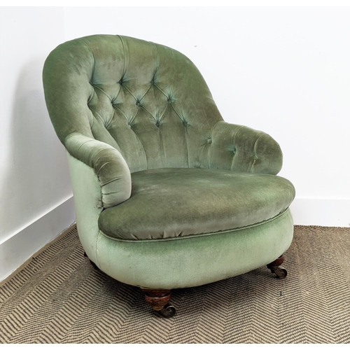 220 - ARMCHAIR, Victorian mahogany in green velvet with brass castors, 80cm H x 69cm W.