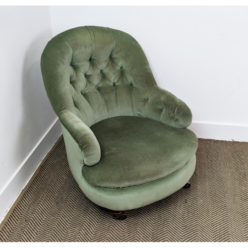 220 - ARMCHAIR, Victorian mahogany in green velvet with brass castors, 80cm H x 69cm W.