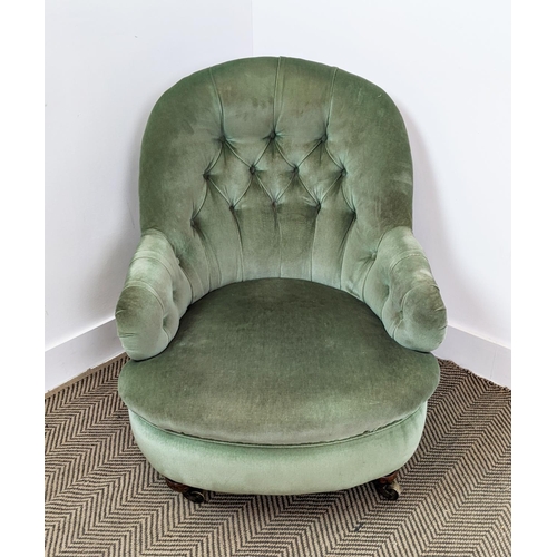 220 - ARMCHAIR, Victorian mahogany in green velvet with brass castors, 80cm H x 69cm W.