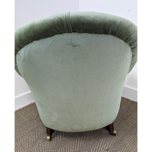 220 - ARMCHAIR, Victorian mahogany in green velvet with brass castors, 80cm H x 69cm W.