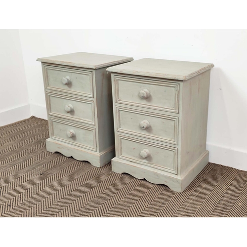 221 - BEDSIDE CHESTS, a pair, grey painted, each with three drawers, 62cm H x 46cm W x 38cm D. (2)