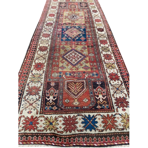 65 - ANTGIQUE CAUCASIAN KAZAK CORRIDOR CARPET, 290cm x 125cm.