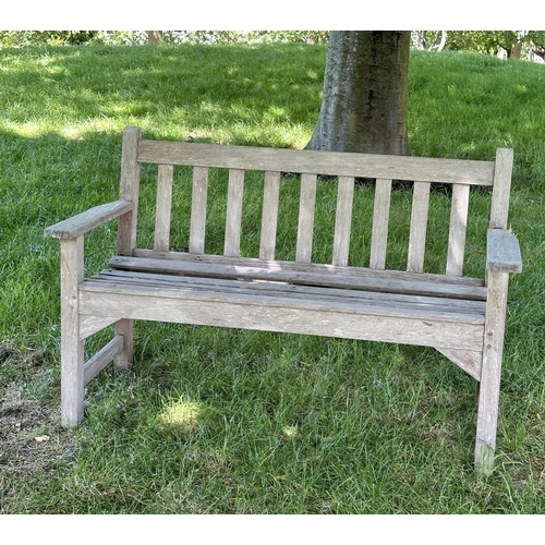 120 - GARDEN BENCH, well weathered slatted teak with flat arms, 82cm H 127cm W.