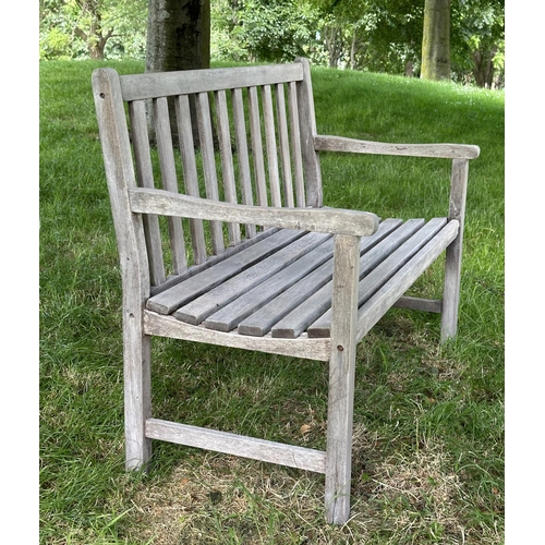 124 - GARDEN BENCH, well weathered slatted teak with shaped arms, 89cm H x 120cm W.