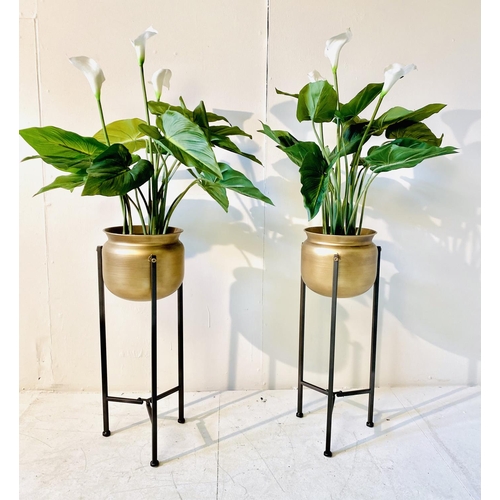 362 - FAUX CALA LILIES, a pair, in gilt metal planters on metal stands, 108cm H (2)