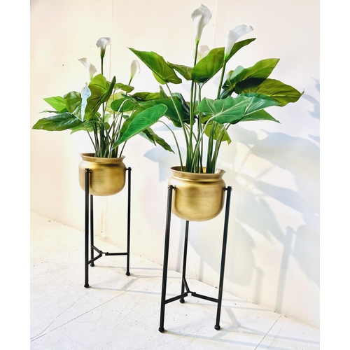 362 - FAUX CALA LILIES, a pair, in gilt metal planters on metal stands, 108cm H (2)