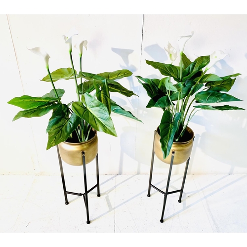 362 - FAUX CALA LILIES, a pair, in gilt metal planters on metal stands, 108cm H (2)