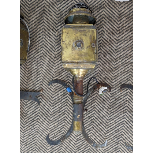 165 - CARRIAGE LAMPS, a pair, four brass, electrified with brackets, each 55cm tall. (2)