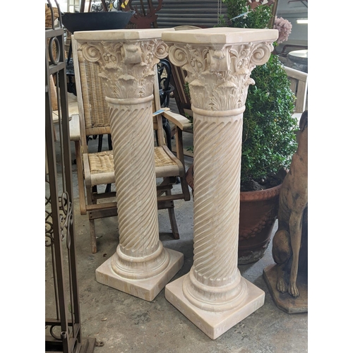 414 - CORINTHIAN COLUMN DISPLAY PEDESTALS, a pair, faux stone, 106cm H.