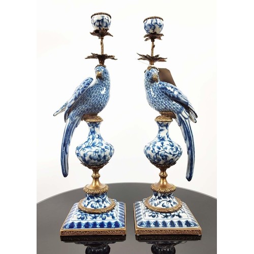 392 - PARROT CANDLESTICKS, a pair, blue and white ceramic and gilt metal, 50cm H. (2)