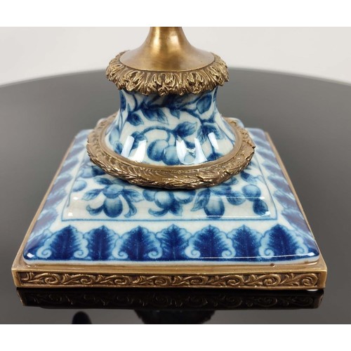 392 - PARROT CANDLESTICKS, a pair, blue and white ceramic and gilt metal, 50cm H. (2)