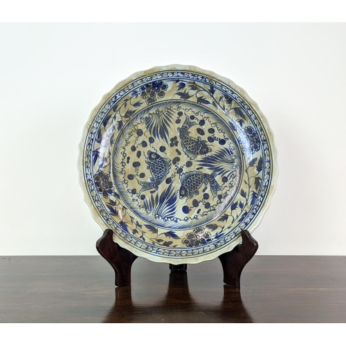 378 - CHINESE STYLE CHARGER, blue and white ceramic on wooden stand, 58cm diam.