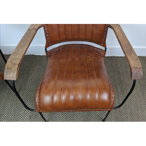 379 - ARMCHAIRS, a pair, tan leather upholstery, 74cm H x 65cm x 70cm. (2)