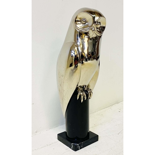 425 - CONTEMPORARY SCHOOL OWL SCULPTURE, polished metal on a marble stand, 44cm H.