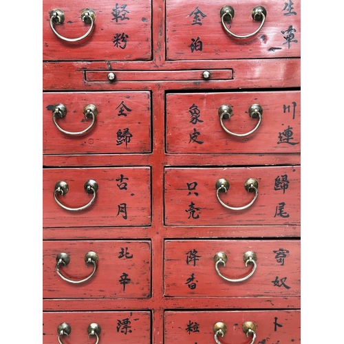 291 - CHINESE CHEST, early 20th century scarlet lacquered with twelve short drawers, slide and silvered me... 