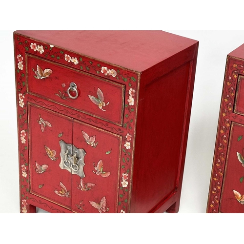 292 - CHINESE CABINETS, a set of two, scarlet lacquered and butterfly decorated, each with two doors and d... 