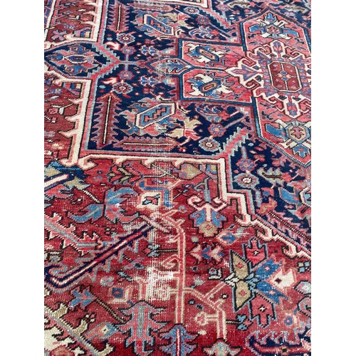 131 - ANTIQUE NORTH WEST PERSIA HERIZ CARPET,  360cm x 290cm.