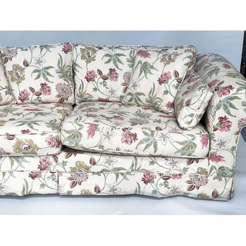 193 - SOFA, English country house style with traditional scroll arms and printed floral cotton upholstered... 