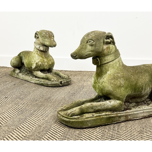 209 - RECUMBENT WHIPPETS, a pair, weathered reconstituted stone, 66cm x 40cm H. (2)