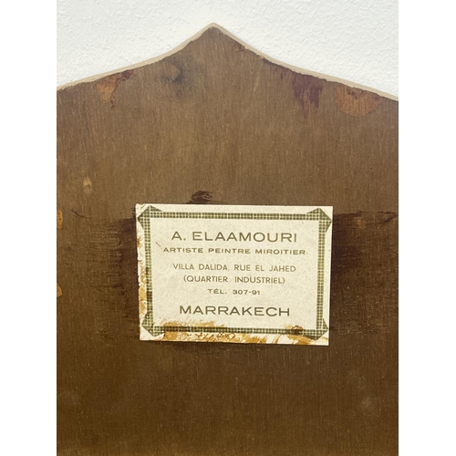 214 - MOROCCAN MIRRORS, a pair, circa 1970's, lacquered frames, bearing labels for A Elaamouri artiste pei... 