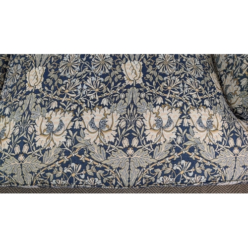 221 - SOFA, Howard style in William Morris honeysuckle patterned upholstery with brass front castors, 95cm... 