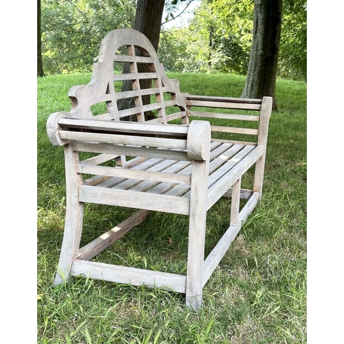 264 - LUTYENS STYLE GARDEN BENCH, well weathered teak of slatted and dowelled construction after the desig... 