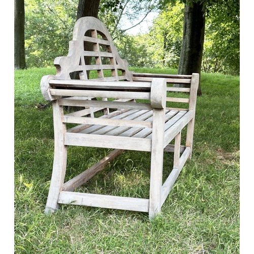 264 - LUTYENS STYLE GARDEN BENCH, well weathered teak of slatted and dowelled construction after the desig... 