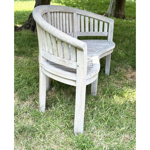 271 - BANANA GARDEN BENCH, well weathered teak of slatted construction with rounded back and arms, 158cm W... 