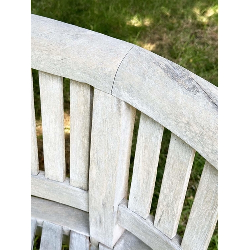 271 - BANANA GARDEN BENCH, well weathered teak of slatted construction with rounded back and arms, 158cm W... 