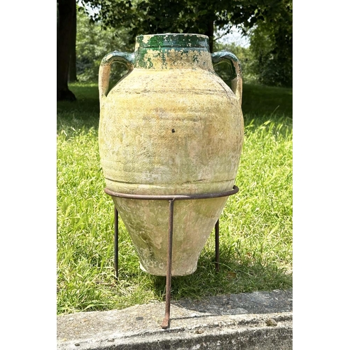 274 - GARDEN AMPHORA, vintage weathered terracotta with moulded loop handles and glazed neck on iron stand... 